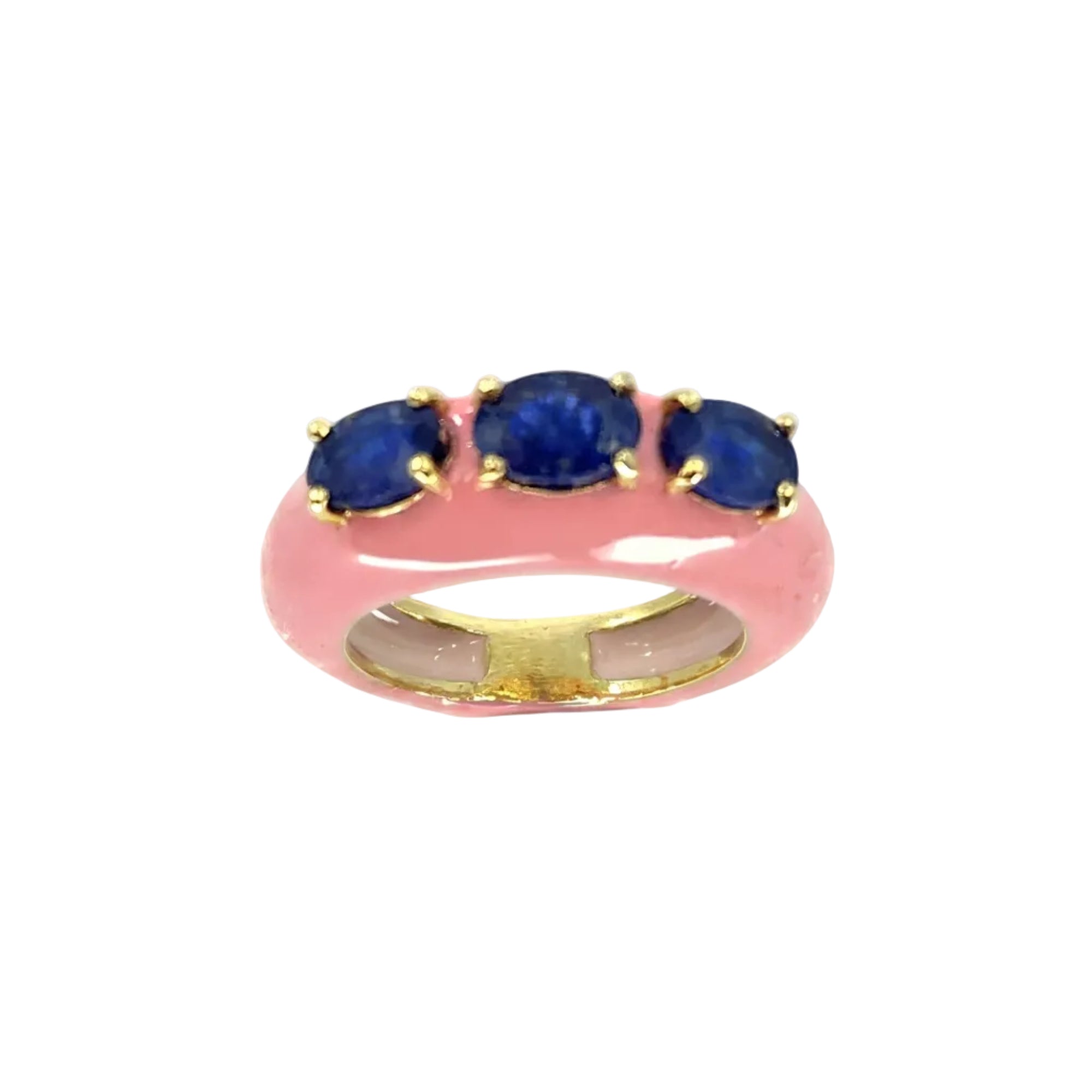 Ring with blue gemstones and gold accents on a white background
