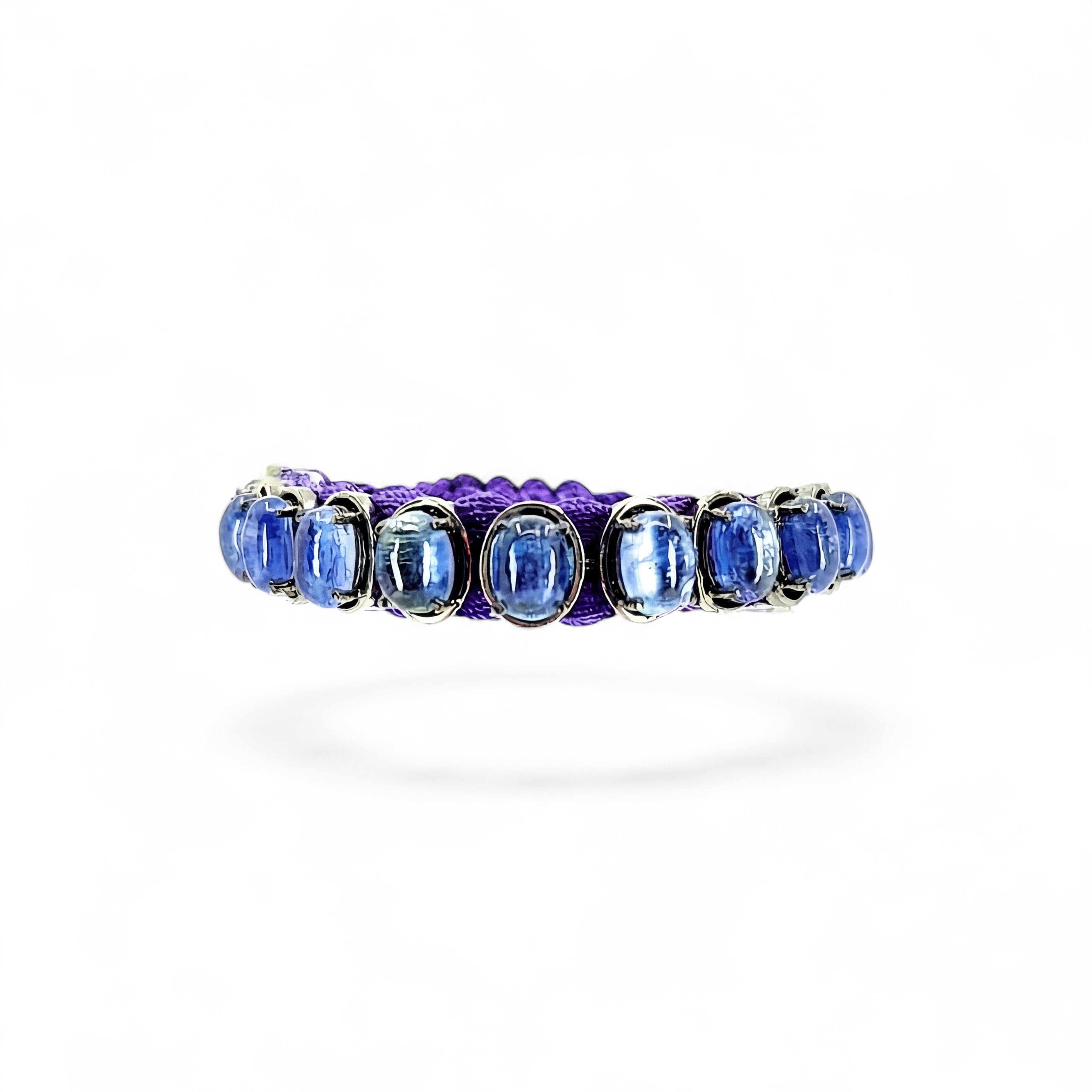 HEILI ROCKS blue kyanite oval gemstone bracelet on purple cord, adjustable sterling silver setting.