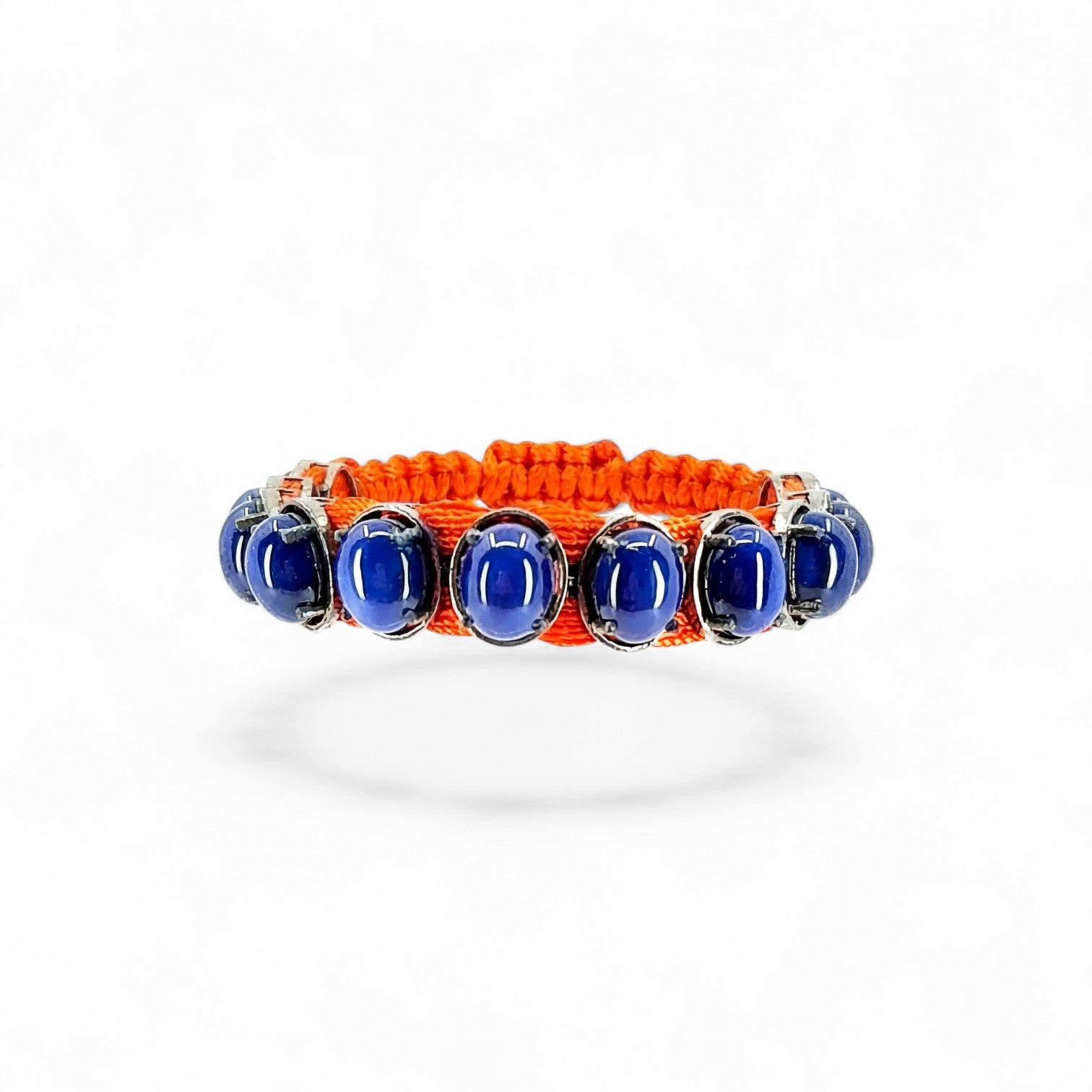 HEILI ROCKS orange cord bracelet with oval-cut blue gemstones in sterling silver settings.