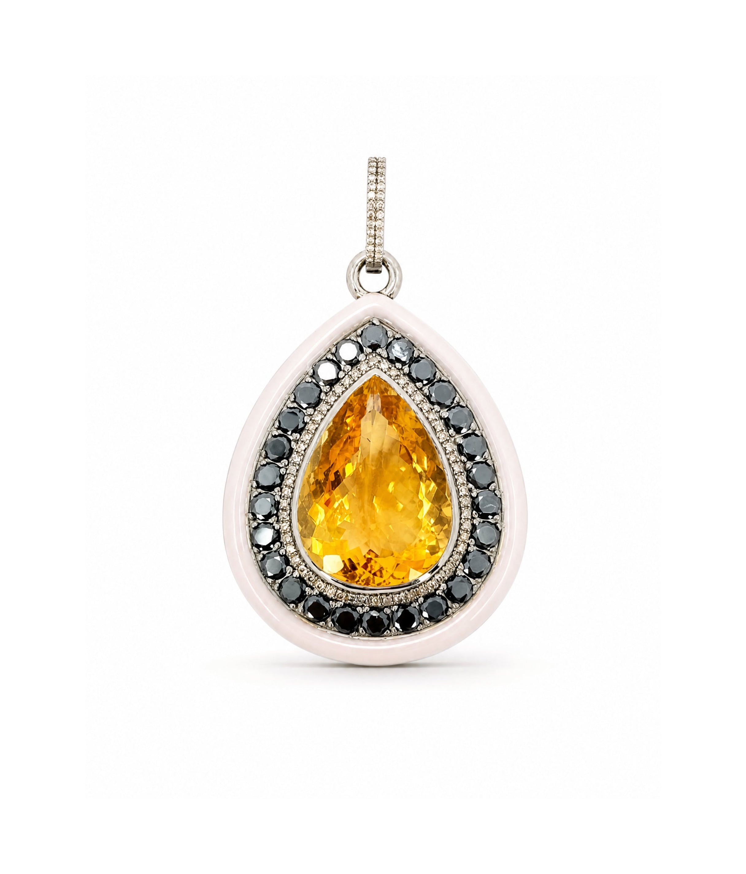 Teardrop-shaped pendant with yellow gemstone and black stones on a white background