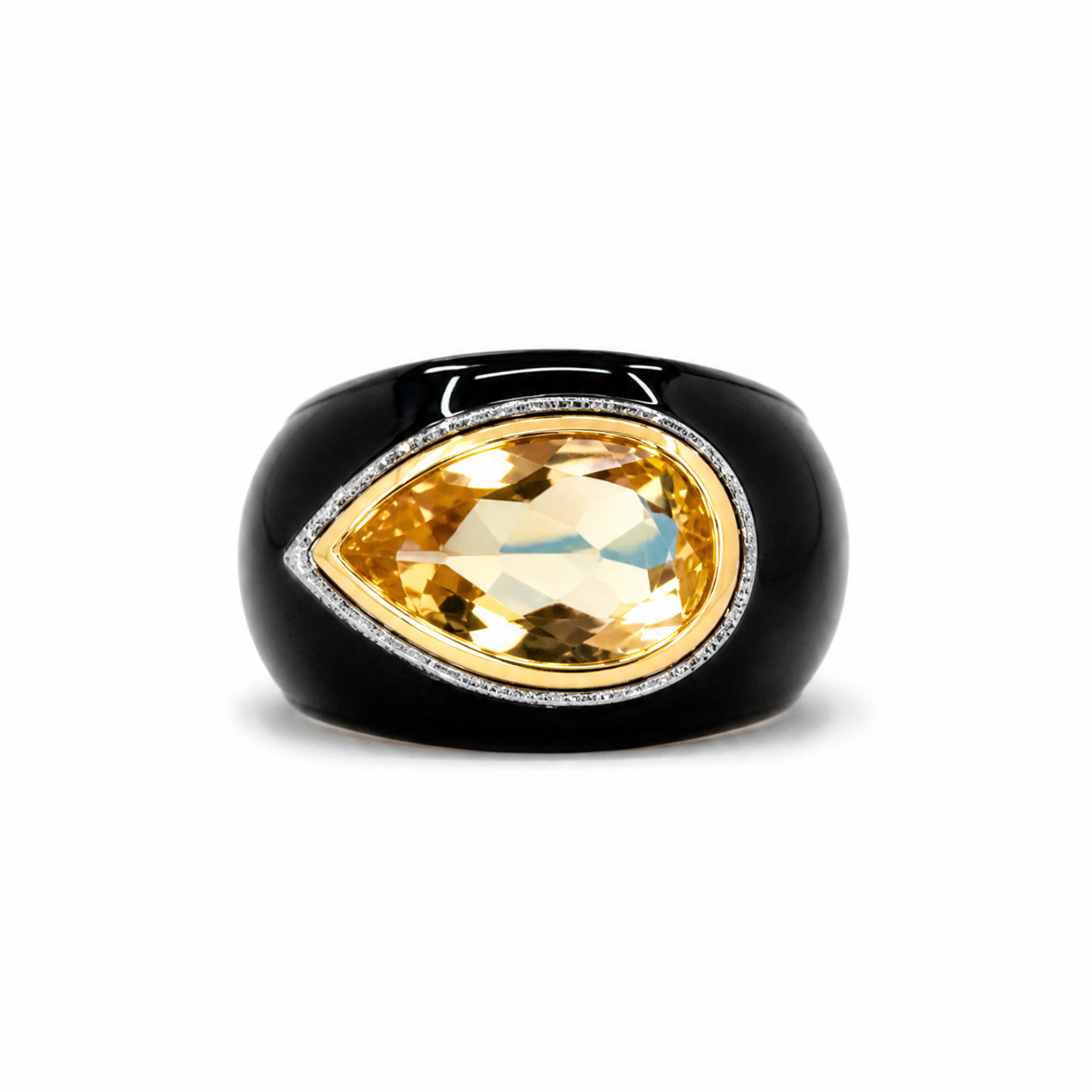 Ring with a yellow gemstone and black band on a white background