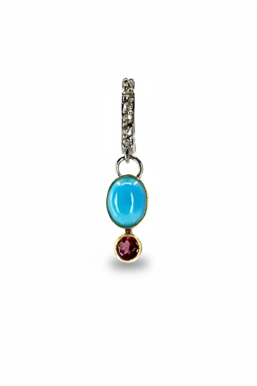 SINGLE DROP EARRING SET AGAINST A WHITE BACKGROUND