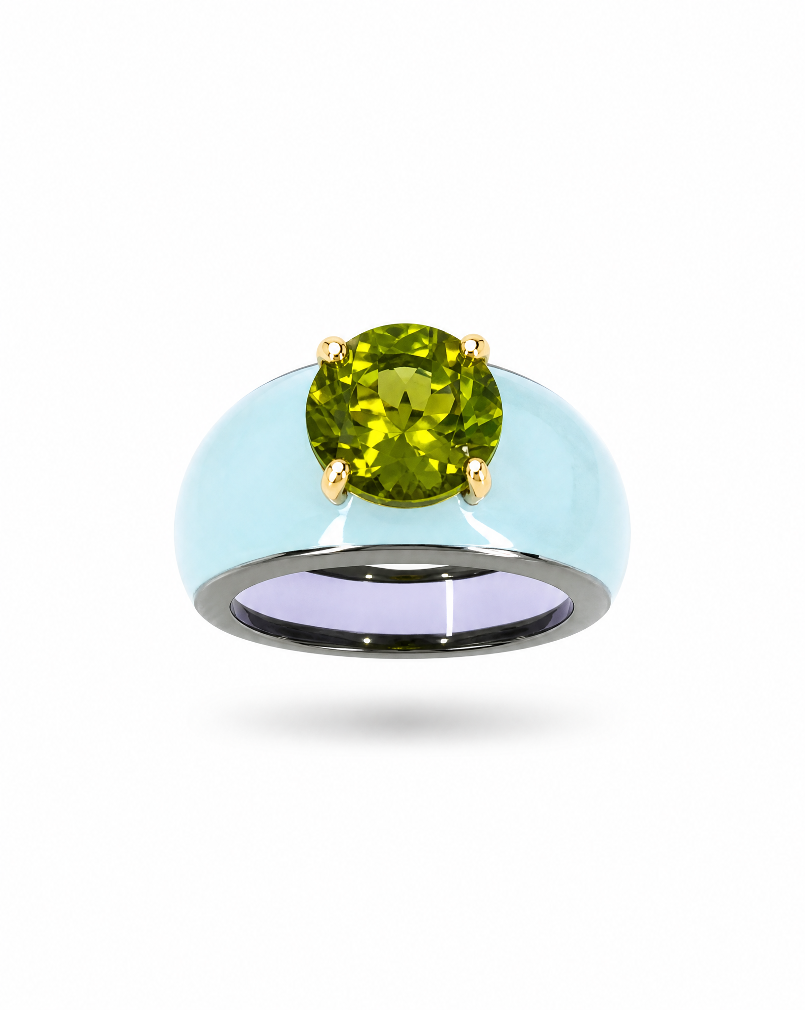 Ring with a green gemstone on a white background