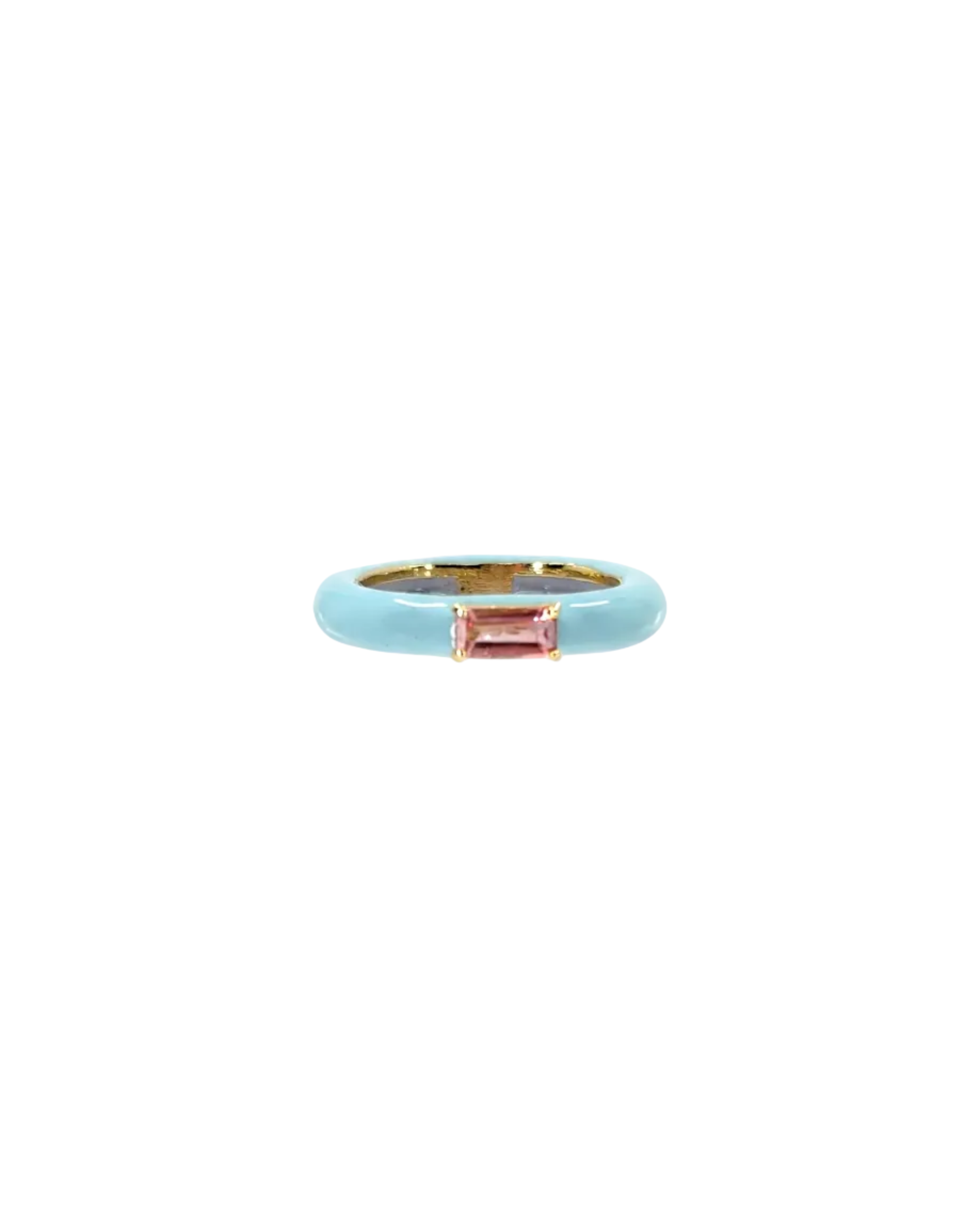 Ring with pink gemstone and gold band on a white background