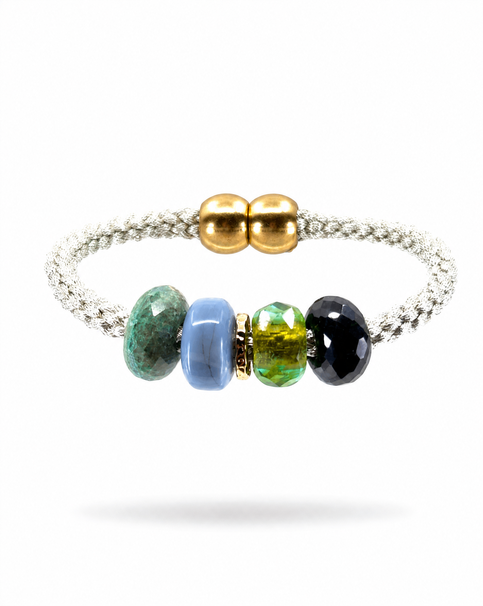 A silver braided cord bracelet featuring four polished gemstone beads in green, light blue, yellow-green, and black, accented by two gold-tone round beads at the closure, shown on a white background.