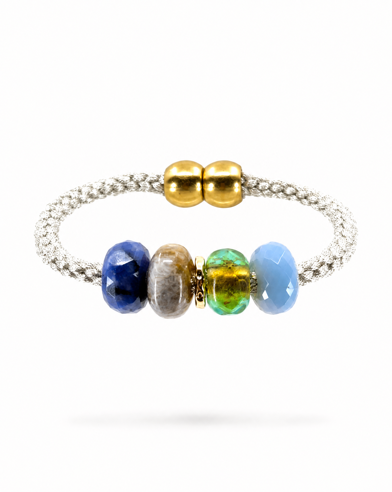 A silver braided cord bracelet featuring five polished gemstone beads in blue, brown, green, and light blue, accented by two gold spacer beads at the closure, shown on a white background.