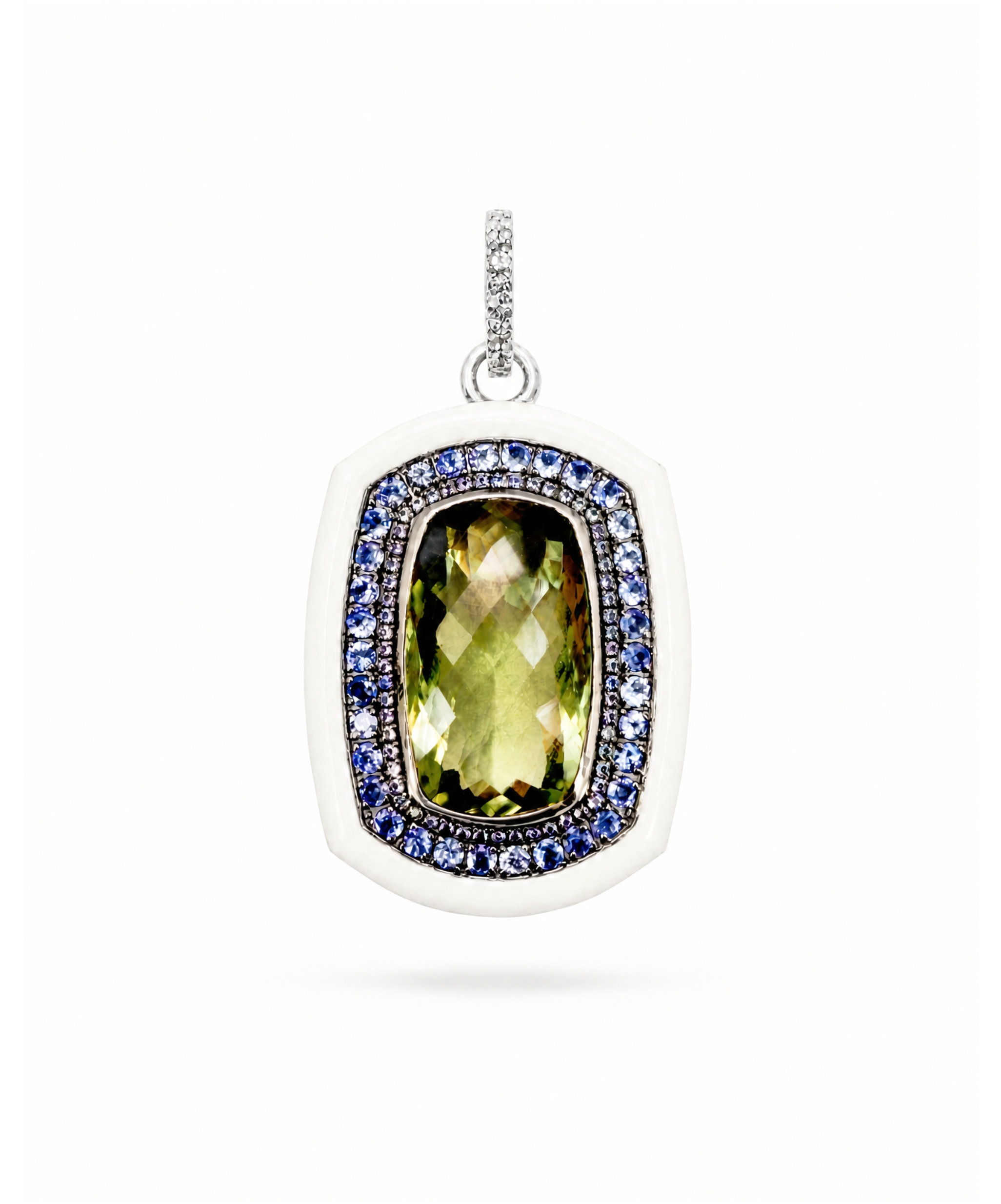 Jewelry pendant with green gemstone and blue stones on a white background