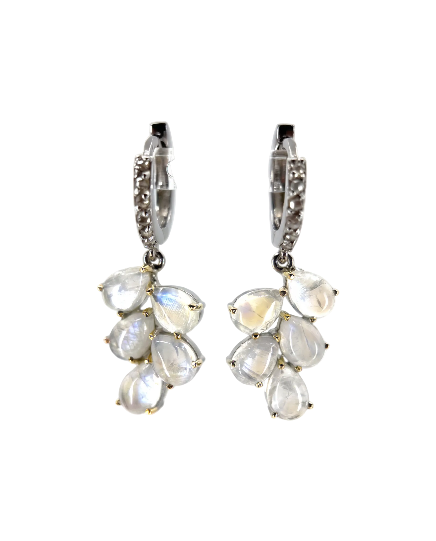 A pair of silver huggie hoop earrings with dangling clusters of teardrop-shaped iridescent white gemstones, shown against a clean white background.