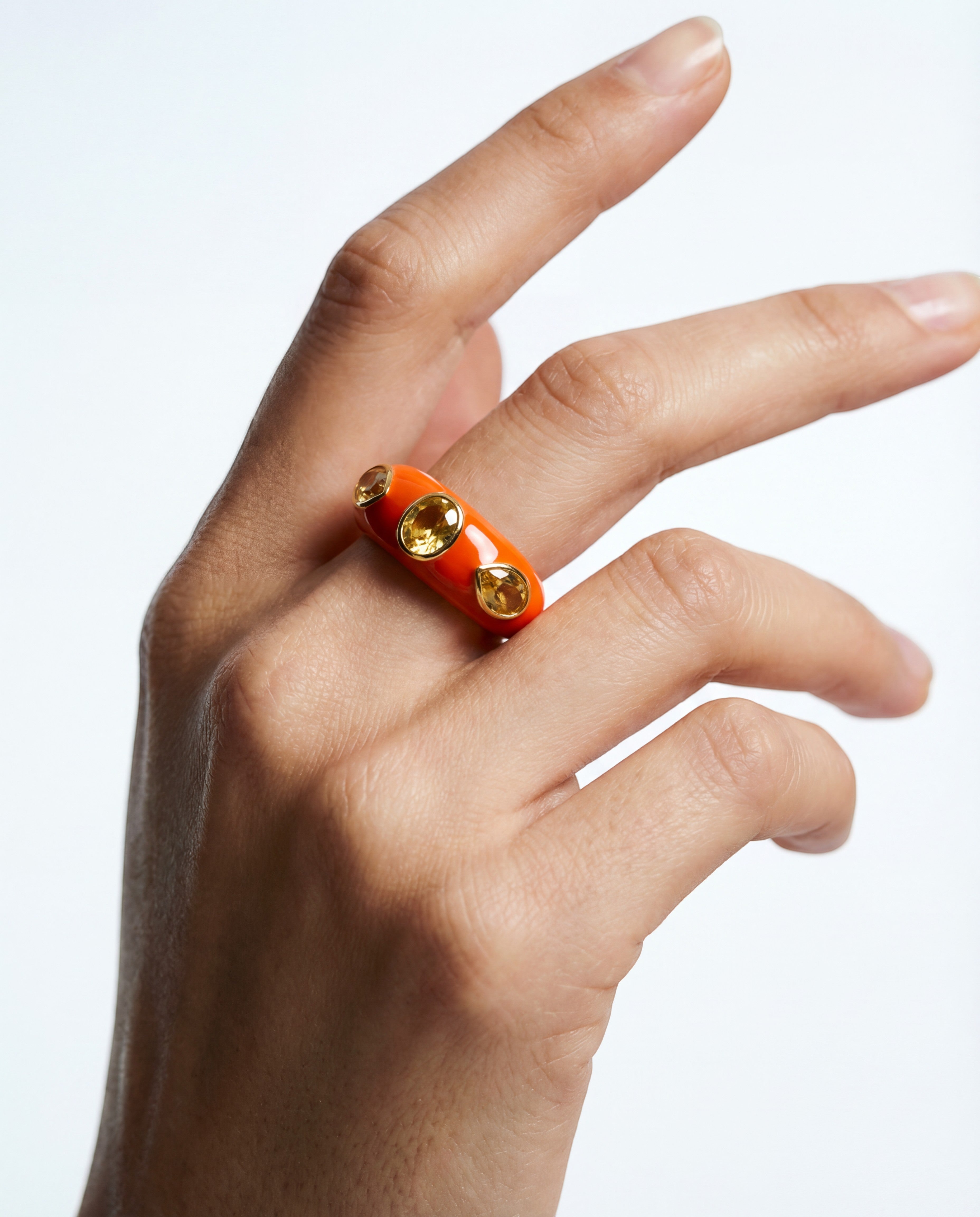 HEILI ROCK Callais Ring: orange enamel band with yellow gemstone cabochons set in sterling silver.
