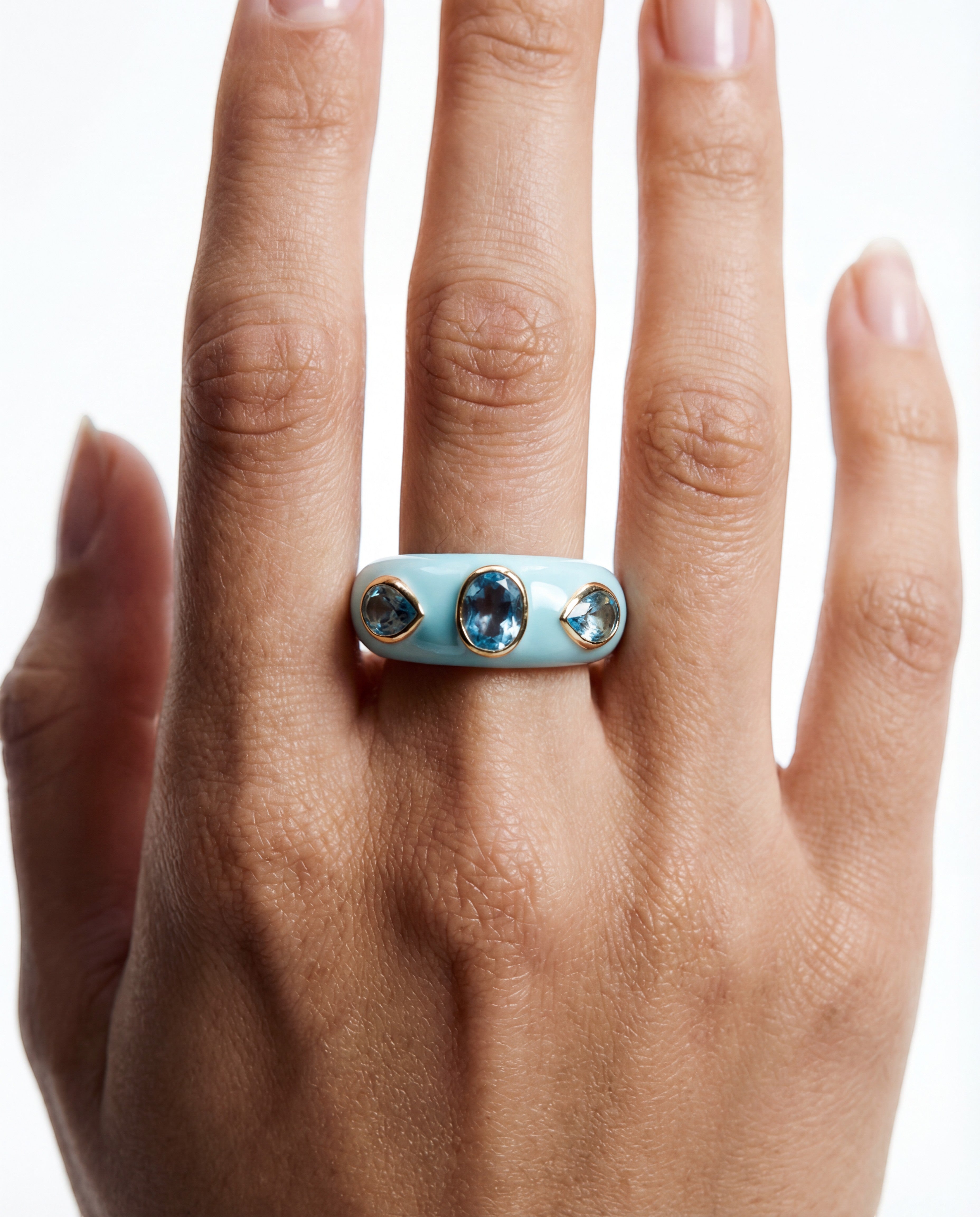 HEILI ROCKS CALLAIS RING: Light blue enamel band ring with three oval blue gemstones and two smaller pear-shaped blue gemstones set in sterling silver.