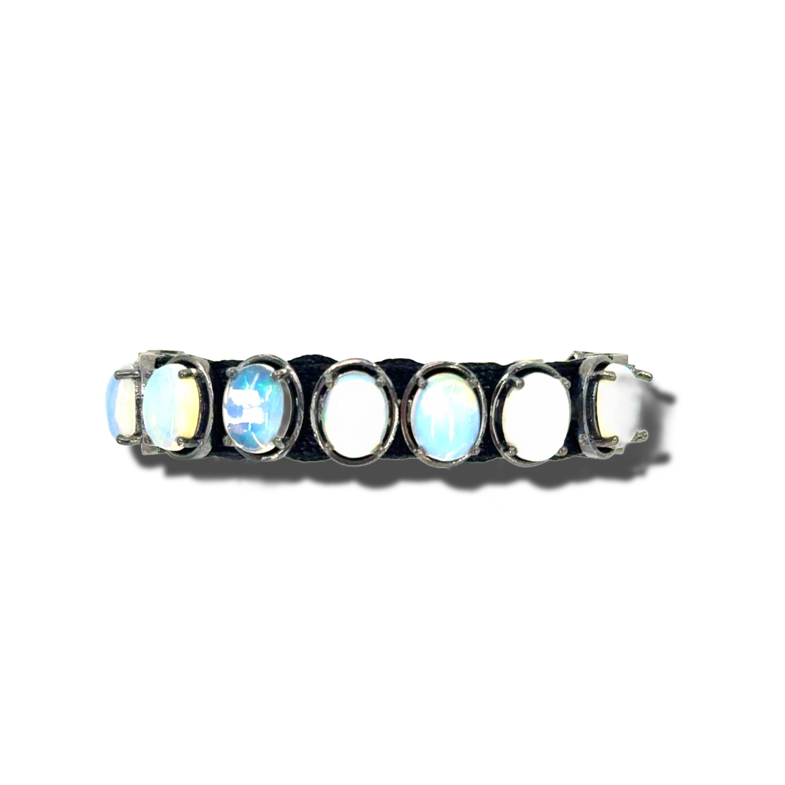 HEILI ROCKS Reef Bracelet with oval-cut opalescent gemstones set in sterling silver on adjustable black cord.